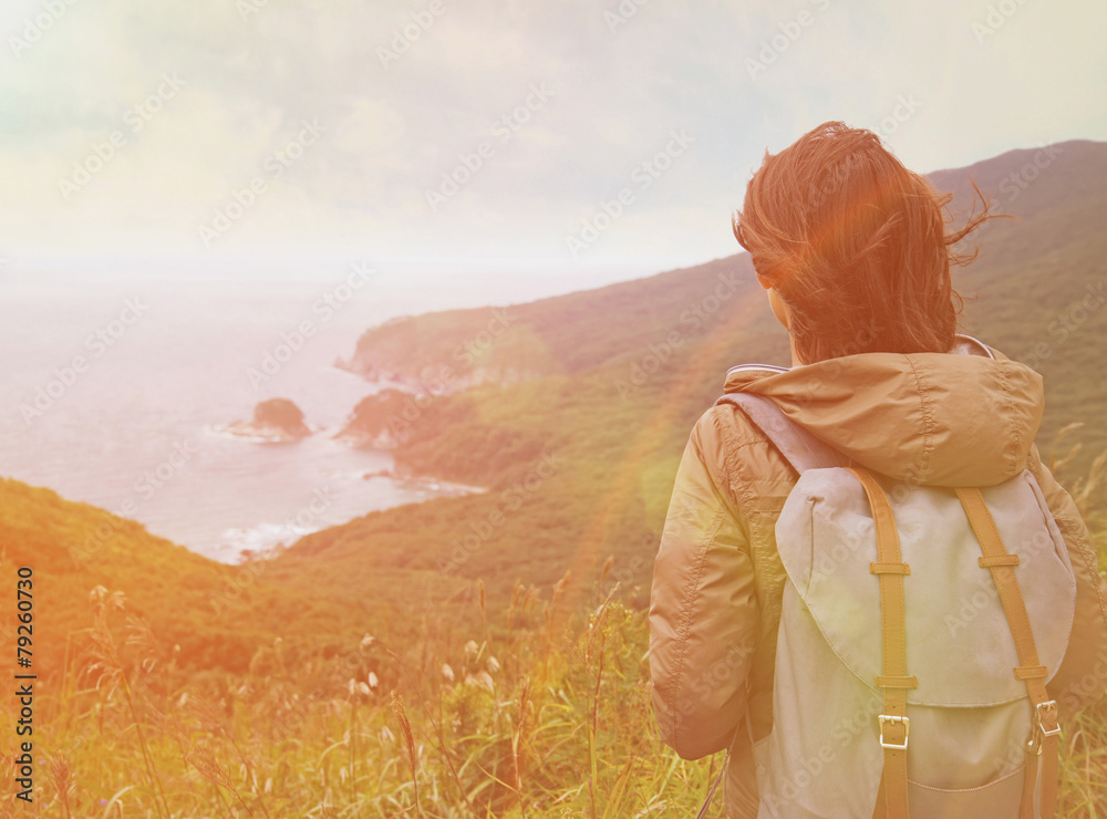 Sticker hiker woman looking to the island in summer