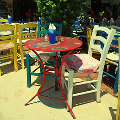 outdoor restaurant with multicolored furniture (Crete, Greece)