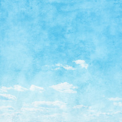 Grunge image of blue sky with white clouds.