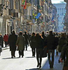 people walking along the street in the city