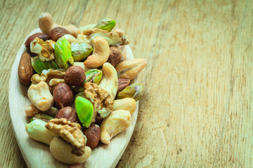 Varieties of nuts: cashew, pistachio, almond.