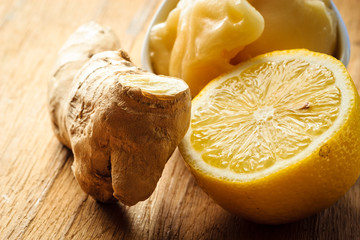 ginger root, honey and lemon on wooden rustic table.