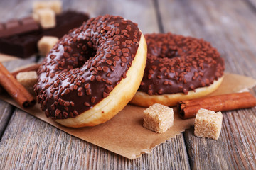 Delicious donuts with icing and chocolate crumb