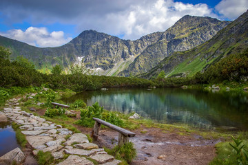 Two Benches next to the Blind lake in Mountains