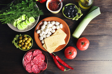 Different products on wooden table close up