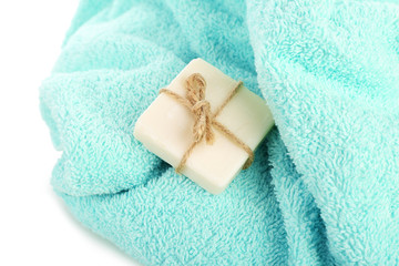 Fototapeta na wymiar Terry towel with soap isolated on white