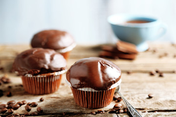 Tasty homemade chocolate muffins and cup of coffee