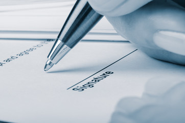 Closeup of somebody signing contract