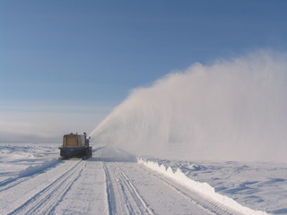 machine cleans snow