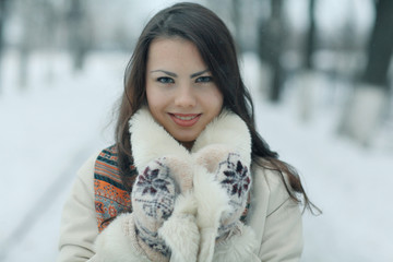 young european model in stylish clothes in the winter forest