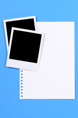 Two blank polaroid style photo frame prints with notepaper or note paper on blue background