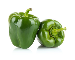 Close-up shot of two green bell peppers isolated on white - Powered by Adobe