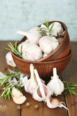 Raw garlic and spices on wooden table