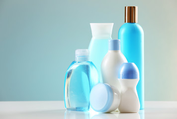 Cosmetic bottles on light background