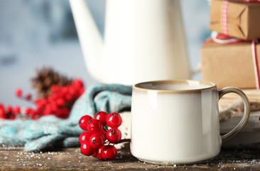 Winter composition with hot beverage on nature background