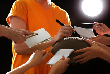 Autographs by American football star on black  background