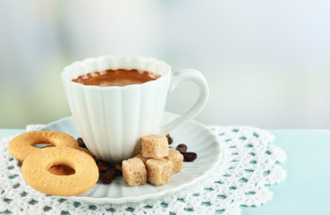 Cup of coffee and tasty cookies