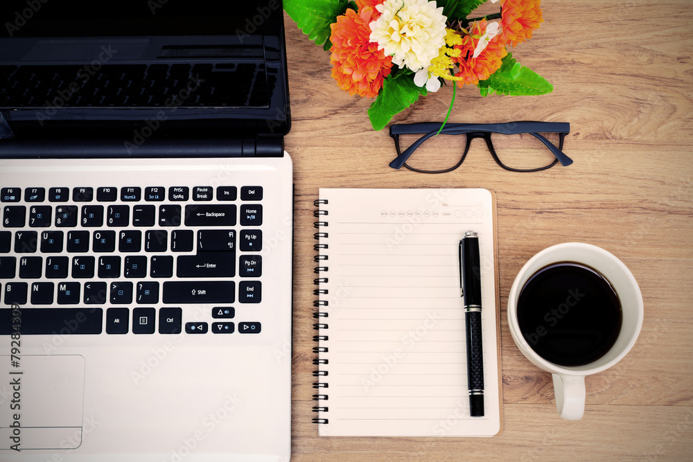 Wall mural laptop and cup of coffee with flower on desk