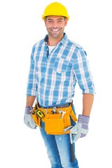 Portrait of smiling handyman wearing tool belt
