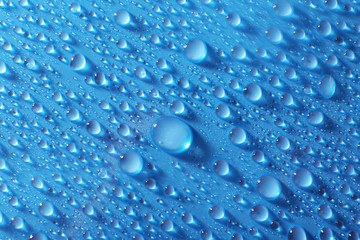 Water drops on light blue background