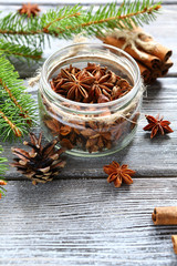 Aromatic anise and cinnamon with pine branches on the boards