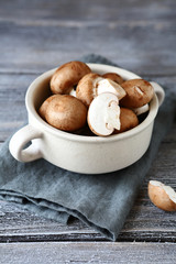 Fresh champignons in a white bowl