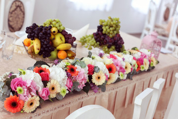 flowers and fruits on wedding table