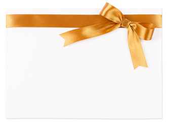 Gold bow on a satin ribbon on a white background