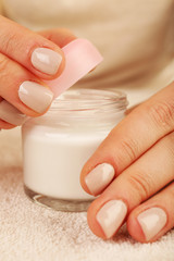 Female hands with jar of cream close up