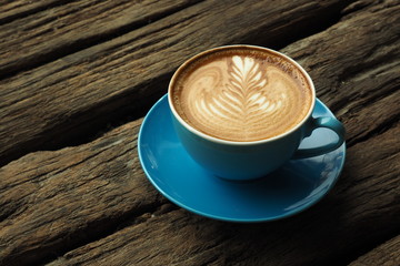 cup of coffee on the wooden desk