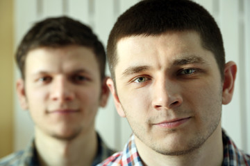 Two handsome young men close up