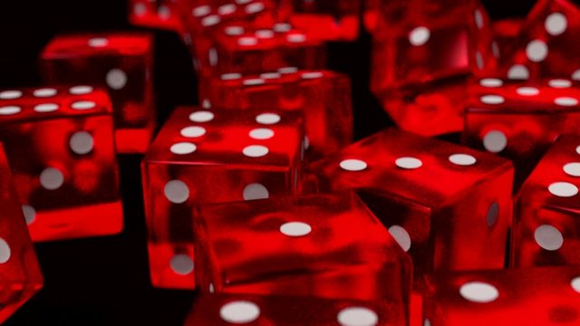 Dice rolling red slow motion closeup DOF on black