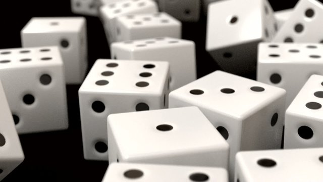Dice rolling white slow motion closeup DOF on black
