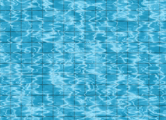 bottom of swimming pool. view on tile floor through water