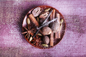 Spices in plate with powdered sugar