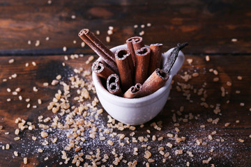 Cinnamon and vanilla sticks with sugar