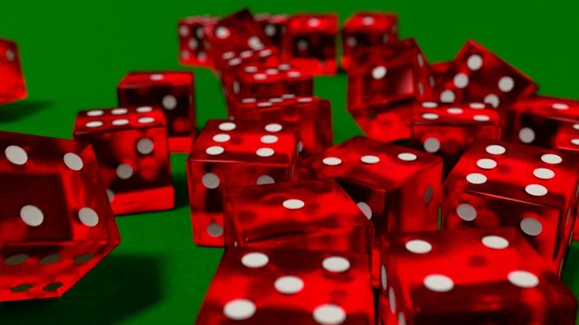 Dice rolling clear red slow motion closeup DOF on green felt tab