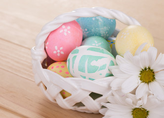 Obraz na płótnie Canvas Easter Eggs in a Basket
