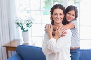 Happy mother and daughter hugging