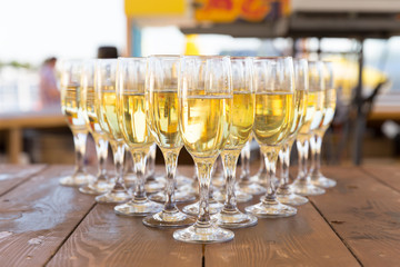 Party row of champagne glasses on table