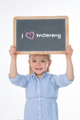 portrait of kid holding blackboard