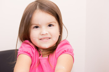 little girl play with flour