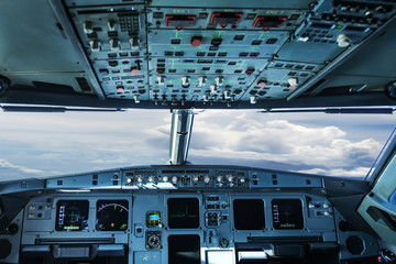 plane cockpit and cloudy sky - obrazy, fototapety, plakaty