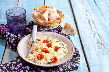 Pasta with sun dried tomatoes, cheese and thyme