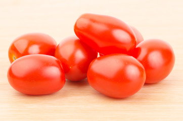 Fresh tomatoes on wooden background