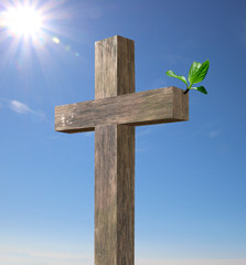 Ostern, Holzkreuz mit grünem Zweig