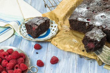 Homemade chocolate brownies with raspberries