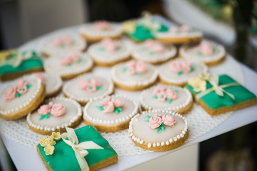 wedding dessert with delicious cakes and macaroons