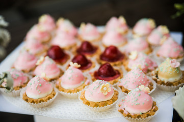 wedding dessert with delicious cakes and macaroons