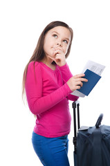 Smiling girl with travel bag, ticket and passport